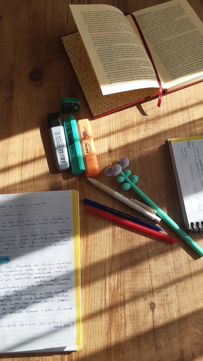 Mastering the First Impression: Your intriguing post title goes here Sunlit study area with open books, pens, and highlighters on a wooden desk.